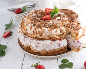 Strawberry cream cake with meringue topping. Traditional german 