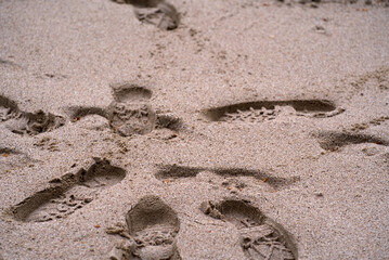 Shoe prints in sand at City of Zürich at Sechseläuten square on a rainy spring day. Photo taken April 25th, 2022, Zurich, Switzerland.
