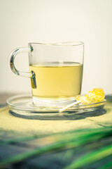 Fresh oriental cup of tea with sugar stick