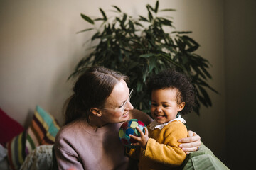 Mother and daughter playing at home