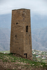 an old dilapidated fortress in the mountains of Dagestan against the backdrop of stunning views of mountains and gorges