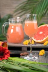 A glass of fresh delicious grapefruit juice