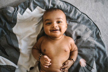 Baby lying on floor