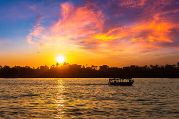 Fototapeta na wymiar Boat on Nile at sunset