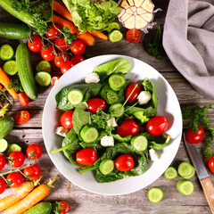 mixed salad with spinach,  tomato,  cucumber