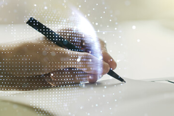 Double exposure of abstract digital world map and man hand writing in notepad on background, big data and blockchain concept