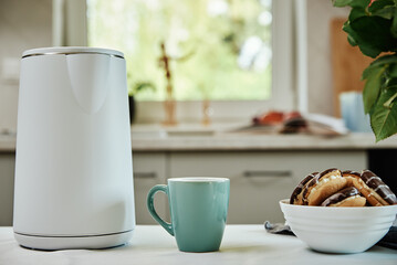 Tea time, Electric kettle with boiled water and cup for preparing tea on table, Morning breakfast at kitchen