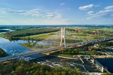Large modern bridge over river in europe city with car traffic, aerial view. Redzinski bridge over...