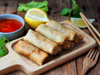 Spring rolls, Egg rolls filled with vegetables serve with sweet and sour dipping sauce.