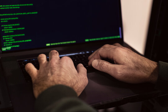 Male programmer working on laptop