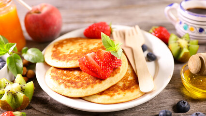 pancakes with strawberry and coffee cup