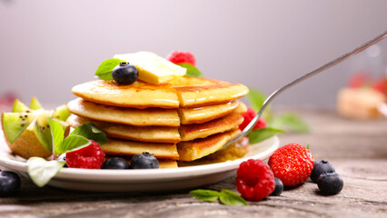 pile of pancakes and berries fruits