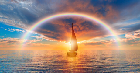Yacht sailing in open sea at stormy day with rainbow - Anchored sailing yacht on calm sea with...