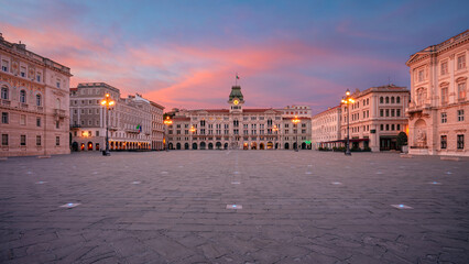 Trieste, Italy. Panoramic cityscape image of downtown Trieste, Italy with main square at dramatic sunrise.