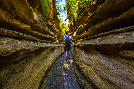 A tourist man in the beautiful canyon of Hell's Gate Park in Naivasha, Kenya