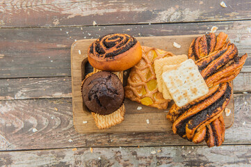 Assorted pastries on a vintage style wooden backdrop