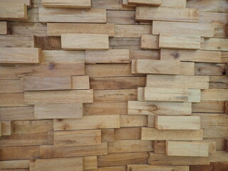 the background of the stacked wooden wall of beautiful wall