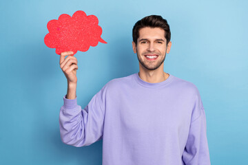 Photo of cute young brunet guy hold mind wear pullover isolated on blue color background