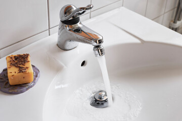 Water running from bathroom tap