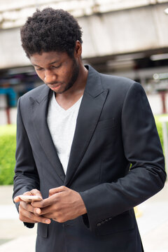 African business man using smartphone mobile application