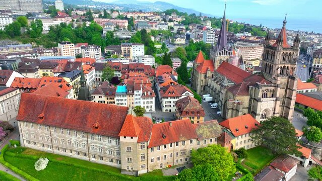 aerial view of Lausanne in Switzerland, capital of Swiss canton of Vaud, flying around medieval Lausanne cathedral, gothic protestant cathedral of Notre Dame in Lausanne