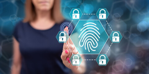 Woman touching a fingerprint security system concept