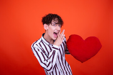 Holidays. Young attractive guy with a gift. 