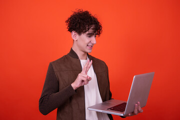 Cheerful funny student with a laptop.	