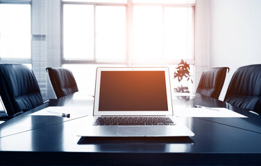 Empty meeting room with laptop