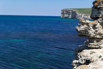White rocks and blue sea.	