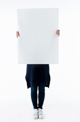 Woman holding a poster isolated on white background