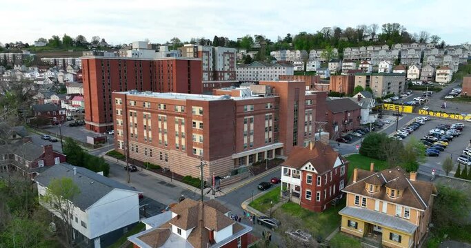 Morgantown West Virginia. WVU campus student housing and academic buildings. Rising aerial.