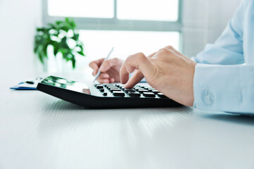 Fototapeta premium Businesswoman analyzing investment charts in office