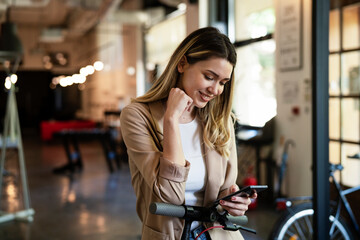 Businesswoman in office. Smiling businesswoman using the phone..