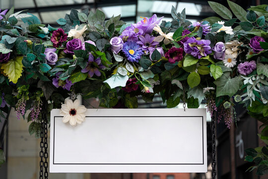 Blank Wedding Board Sign Mockup Scene. Empty White Welcome Board With Flowers. Floral Garland On Arc, Birthday Party Decoration