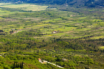 Fototapeta na wymiar Fields and villages in Konavle region near Dubrovnik. Bird's-eye shot.