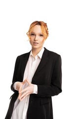 Young businesswoman standing in white studio and looking at camera