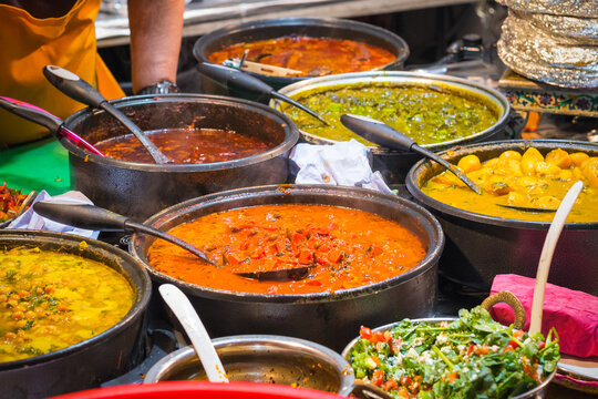 A variety of curries on display at Brick Lane Market in London
