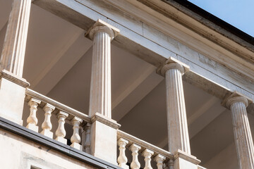 Balcony surrounded by a balustrade and columns in Italian marble