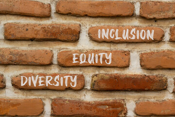 Diversity equity inclusion symbol. Concept words Diversity Equity Inclusion on brick wall. Beautiful brick wall background. Business and diversity equity inclusion concept. Copy space.