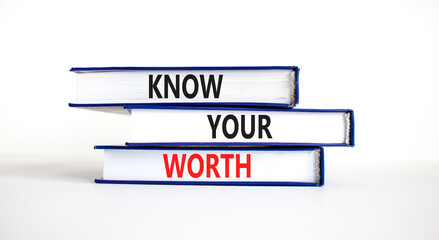 Know your worth symbol. Concept words Know your worth on books. Beautiful white table white background. Business and know your worth concept. Copy space.