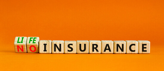 Life insurance symbol. Turned wooden cubes and changed concept words No insurance to Life insurance. Beautiful orange table orange background. Business and Life insurance concept. Copy space.