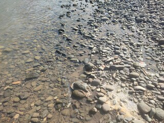 rocks around the river in the daytime