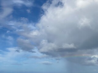 Long rainbow with dramatic clouds over the Ala Moana beach oahu Island, Hawaii year 2022