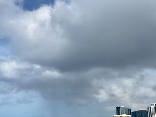 Long rainbow with dramatic clouds over the waikiki beach oahu Island, Hawaii year 2022