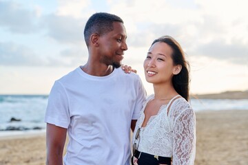 Young couple in love on the beach together.