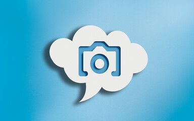 Photo Camera Icon in White Cloud Speech Bubble on Blue