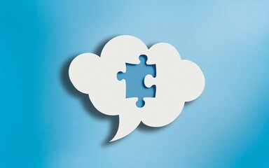 Jigsaw Puzzle Icon in White Cloud Speech Bubble on Blue
