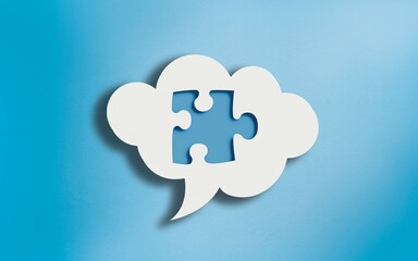 Jigsaw Puzzle Icon in White Cloud Speech Bubble on Blue