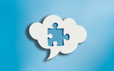 Jigsaw Puzzle Icon in White Cloud Speech Bubble on Blue